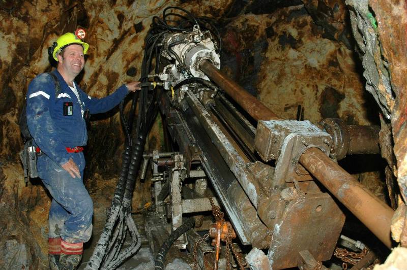 UNDERGROUND DRILL RIG IN OPERATION UNDERGROUND AT THE TALISMAN MINE