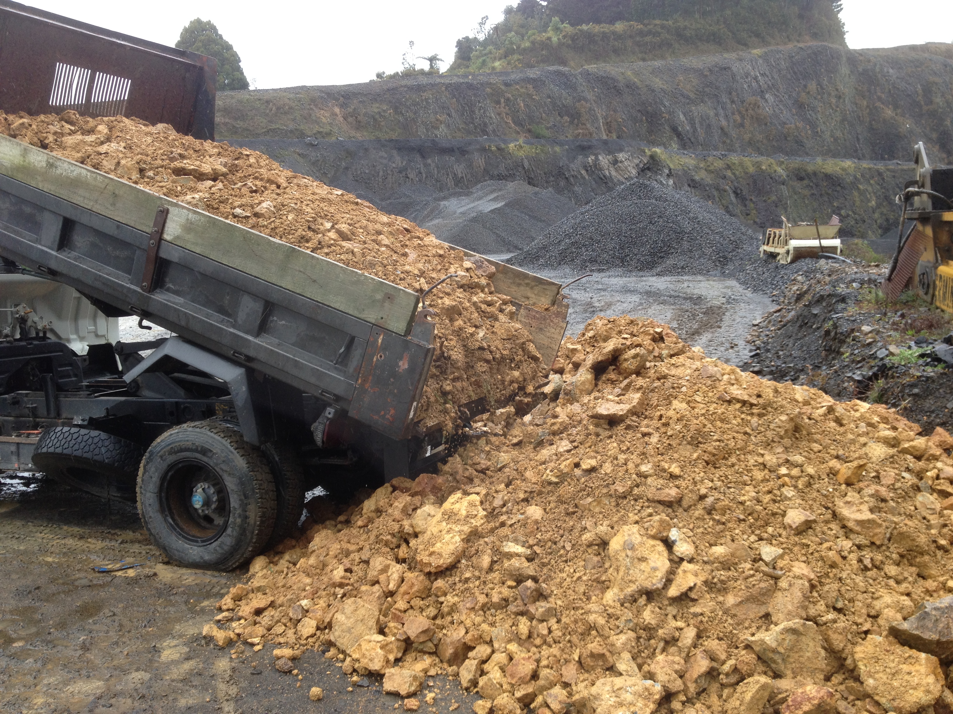 STOCK PILED ORE BEING PREPARED FOR TREATMENT AT A LOCAL GOLD PLANT