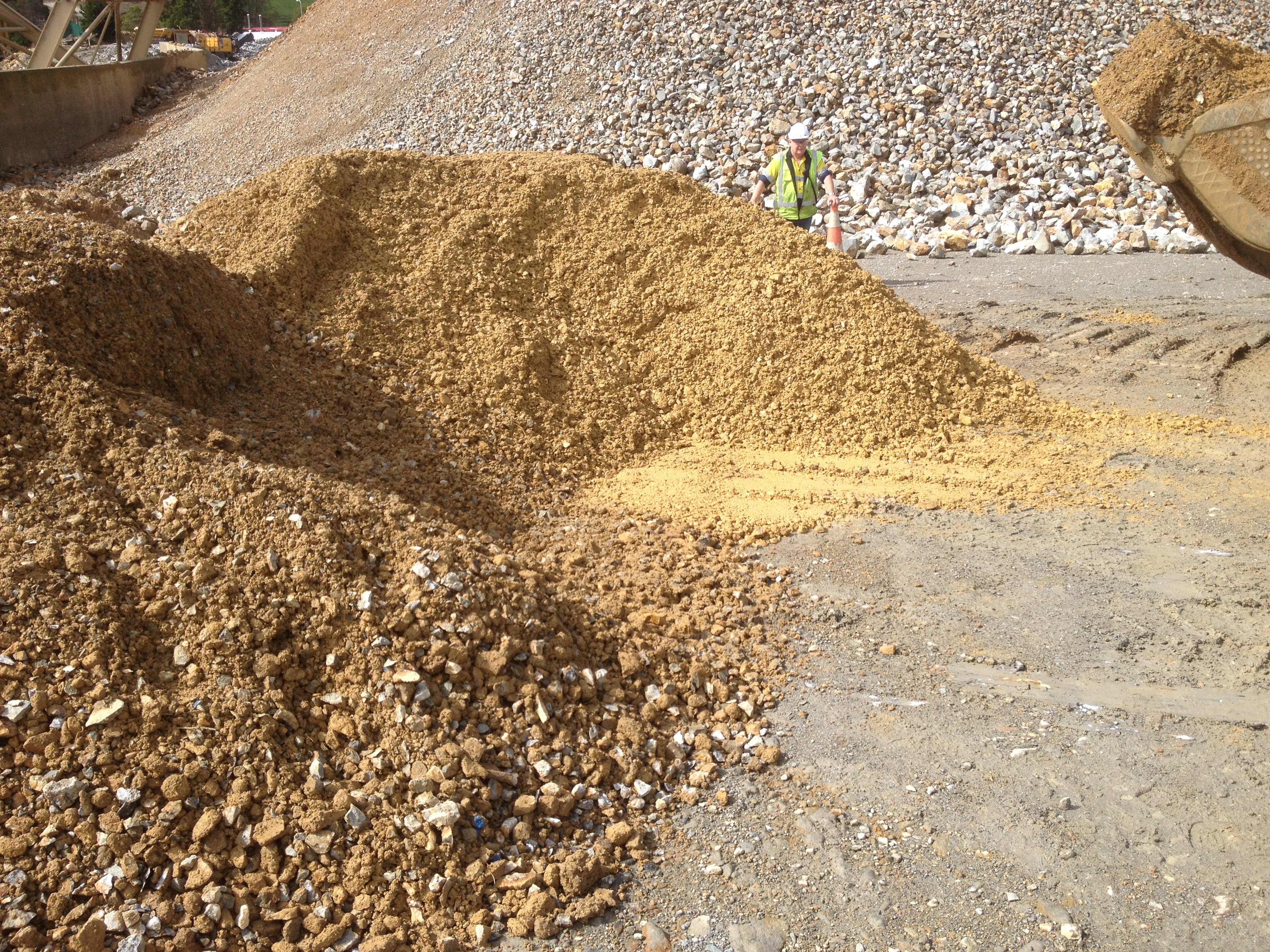 STOCK PILED ORE BEING PREPARED FOR TREATMENT AT A LOCAL GOLD PLANT